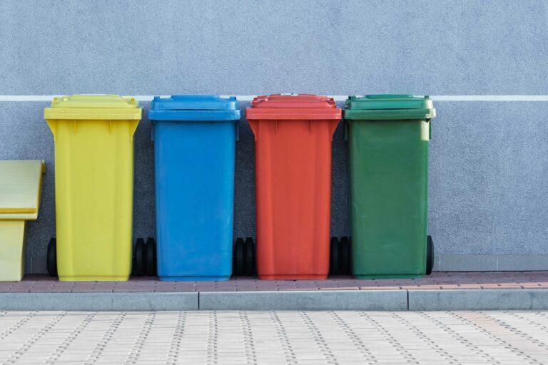 trash bin in different colors for recycling: yellow, blue, red and green